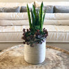 Striped pot with faux succulents - Centered, Inc.