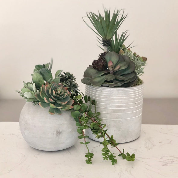 Striped pot with faux succulents - Centered, Inc.